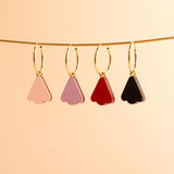 wooden petals on golden hoop earrings
