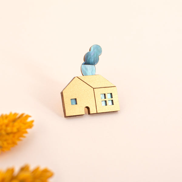 House brooch with gold painted wood and aquamarine pearl veneer